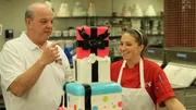 Mauro and Liz admiring the engagement cake.