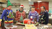 Boys admiring the ugly sweater cake.
