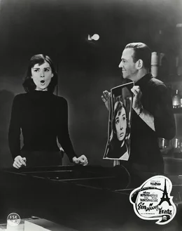 1. Der Starphotograph Dick Avery (Fred Astaire) hat von der kleinen Verk&auml;uferin Jo (Andrey Hepburn) ein Photo gemacht, womit er ihr zu einer Karriere verhelfen will.