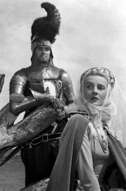 Mordred (Stanley Baker, li.) hat in Fee Morgan (Anne Crawford, re.) eine Verb&uuml;ndete.