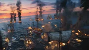 Mehrere h&ouml;lzerne Schiffe befinden sich in einem gro&szlig;en Seegefecht, w&auml;hrend Flammen und dichter Rauch &uuml;ber dem Wasser zu sehen sind.