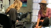 Emily Ackerman shows her foot to her friend in the salon.