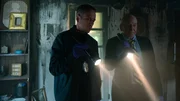 RECREATION - Detective Dresback (James Anderson) and Detective Drapeau (Alex Mannone) shine flashlights on crime scene.