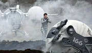Jack (TOM CRUISE) cautiously approaches a drone in Oblivion, an original and groundbreaking cinematic event from the visionary director of TRON: Legacy and producers of Rise of the Planet of the Apes.