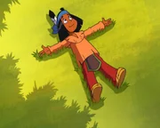 Yakari legt sich ins Gras.