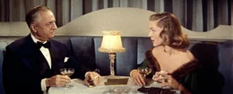 Die h&uuml;bsche Schatze Page (Lauren Bacall, re.) testet den wohlhabenden J.D. Hanley (William Powell, li.) auf Herz und Niere ...