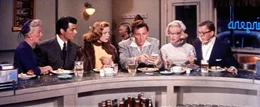 Loco (Betty Grable, li.), Eben (Rory Calhoun, 2.v.re.), Schatze Page (Lauren Bacall, 3.v.li.), Pola (Marilyn Monroe, 2.v.re.) und Freddie (David Wayne, re.) staunen nicht schlecht, als sich Tom (Cameron Mitchell, 3.v.re.) als Million&auml;r entpuppt ...
