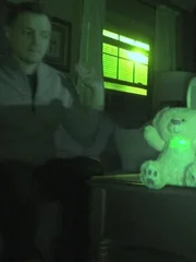 Paranormal investigator Adam Berry reacts to an invisibly triggered talking toy in a private home in Guilderland, NY.