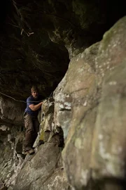 Jeremy Whalen examines a cave entrance.