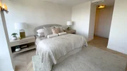 Interior shot of main bed. Walls painted white, white oak herringbone floors, and main bath situated so as to not bleed into bedroom like before. After 16, as seen on Windy City Rehab, Season 4. Interior shot of main bed. Walls painted white, white oak herringbone floors, and main bath situated so as to not bleed into bedroom like before. After 16, as seen on Windy City Rehab, Season 4.