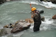 Carlos Minor rigs a huge boulder ready for a lift.