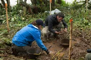Mehgan Heaney-Grier and Brett Tutor dig for Guarani artifacts.