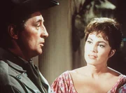 Nach allen Regeln der Kunst umwirbt der kauzige Sheriff Harrah (Robert Mitchum, l.) die charmante Maudie (Charlene Holt, r.) ...