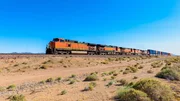 Freight Train driving through Mojave Desert along Route 66, California, USA.