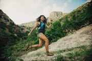 Eva runs with her handmade running sandals.
