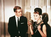George Peppard (Paul Varjak), Audrey Hepburn (Holly Golightly).