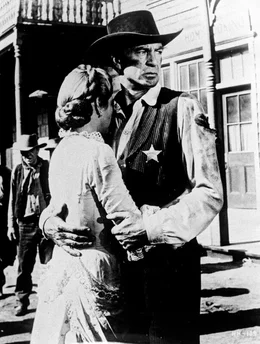 Grace Kelly (Amy Kane), Gary Cooper (Marshal Will Kane).
