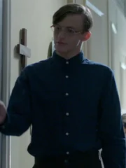 Wallace (Michael Buoni) leads a young girl to a private space.