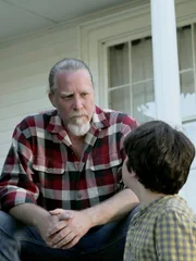 L-R: Michael Ryan speaks to his son, Dennis.