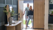 Homeowners Tim and Paige Cota react to seeing their new home for the first time, as seen on Help! I Wrecked My House, Season 4.