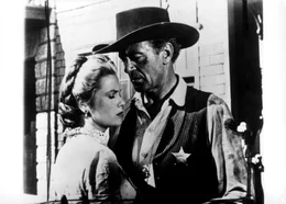 Amy (Grace Kelly, l.) bittet ihren Mann Sheriff Will Kane (Gary Cooper, r.), nicht mit dem eiskalten M&ouml;rder Miler zu duellieren. Doch Kane will seiner Aufgabe als Sheriff gerecht werden ...