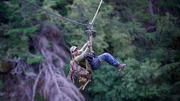 Carlos crossing the zip line. Carlos crossing the zip line.