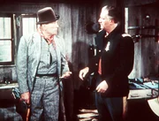 L-R: Top Sgt. Quincannon (Victor McLaglen), Capt. Nathan Cutting Brittles (John Wayne)
