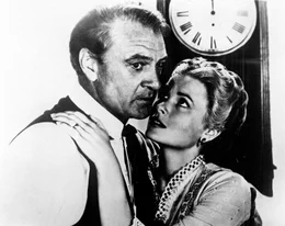 Gary Cooper (Marshal Will Kane), Grace Kelly (Amy Kane).