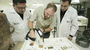 Josh Gates, Diego Matute and Marcos Sampertegui use an XRF Gun to determine the composition of Father Carlo Crespi's artificats at the Pumapungo Museum in Cuenca, Ecuador, as seen on Travel Channel's Expedition Unknown. Josh Gates, Diego Matute and Marcos Sampertegui use an XRF Gun to determine the composition of Father Carlo Crespi's artificats at the Pumapungo Museum in Cuenca, Ecuador, as seen on Travel Channel's Expedition Unknown.