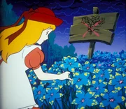 Alice hat die blaue Zauberblume gefunden, mit deren Hilfe man Mensch und Tier verschwinden lassen kann.