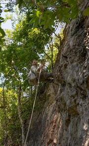 Hazen Audel rappels down a cliff.
