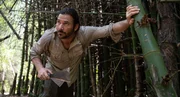 Hazen Audel cuts his way through a bamboo forest in Thailand.