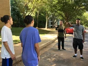 Ron and Tron hold up their guns towards Alex and Josh.