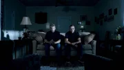 Older twins are on the couch.