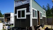 Charli Schmidt's tiny house build has made tons of progress with the exterior siding almost complete featuring gorgeous, seafoam green metal siding that was salvaged from a 120 year old barn on San Juan Island, Washington, as seen on Tiny house, Big Living. Charli Schmidt's tiny house build has made tons of progress with the exterior siding almost complete featuring gorgeous, seafoam green metal siding that was salvaged from a 120 year old barn on San Juan Island, Washington, as seen on Tiny house, Big Living.