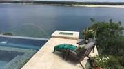 The Pool Kings designed a small patio for lounging and overlooking the lake, the pool, and the spa. The Pool Kings designed a small patio for lounging and overlooking the lake, the pool, and the spa.