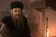 Matthew and Diana arrive in Bohemia to search for Edward Kelley and the Book of Life, which they believe to be in his possession. They meet Emperor Rudolf II, who immediately expresses a lascivious interest in Diana; she uses his interest to get inside his fabled collection of magical artifacts in search of the Book of Life, but Gallowglass can only find chilling evidence of Rudolf&rsquo;s morbid fascination with creatures. Matthew&rsquo;s protective jealousy causes problems as he and Diana are invited on a grouse hunt: pushed to the edge by the Emperor&rsquo;s advances, Matthew sets his bird on Rudolf&rsquo;s and inflames the Emperor&rsquo;s wrath. At dinner, Diana chooses to reveal her power to Rudolph when provoked by the manner in which Rudolf treats a Rabbi, and she magically animates a serpent. Knowing her power is exposed, Matthew, Diana and Gallowglass make a daring bid for the Book,and discover it in the hands of a raving Edward Kelley. He tears three pages out before they can steal it from him and flee, and Matthew realises that the Book is made from the skin of creatures. In the present day, Knox arrives at the Emperor&rsquo;s lodge, and sees evidence that the Book was once there; he is getting closer.bird on Rudolf&rsquo;s and inflames the Emperor&rsquo;s wrath. At dinner, Diana chooses to reveal her power to Rudolph when provoked by the manner in which Rudolf treats a Rabbi, and she magically animates a serpent. Knowing her power is exposed, Matthew, Diana and Gallowglass make a daring bid for the Book, and discover it in the hands of a raving Edward Kelley. He tears three pages out before they can steal it from him and flee, and Matthew realises that the Book is made from the skin of creatures. In the present day, Knox arrives at the Emperor&rsquo;s lodge, and sees evidence that the Book was once there; he is getting closer.