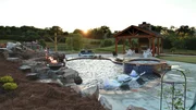 Peek Pools and Spas has completely transformed this backyard into the Paxson Family's dream as seen on Pool Kings. AFTER 3 (exterior, after) Peek Pools and Spas has completely transformed this backyard into the Paxson Family's dream as seen on Pool Kings. AFTER 3 (exterior, after)