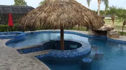The Hairston Family's brand new pool with a swim up bar covered tiki hut as seen on Pool Kings. (exterior) The Hairston Family's brand new pool with a swim up bar covered tiki hut as seen on Pool Kings. (exterior)