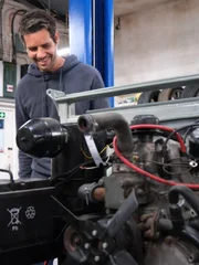 Marc (Elvis) Priestley works on the Landrover in the garage. Marc (Elvis) Priestley works on the Landrover in the garage.