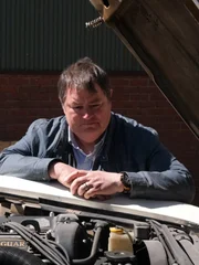 Mike posing. Open front bonnet of car. Mike posing. Open front bonnet of car.