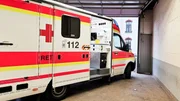 E5 - An ambulance with open sliding door in a garage. It belongs to the German Red Cross. The emergency call number is to be seen. E5 - An ambulance with open sliding door in a garage. It belongs to the German Red Cross. The emergency call number is to be seen.