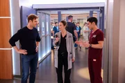 CHICAGO MED -- "A Game of Inches" Episode 1102 -- Pictured: (l-r) Nick Gehlfuss as Dr. Will Halstead, Sarah Ramos as Dr. Caitlin Lenox, Darren Barnet as Dr. John Frost -- (Photo by: George Burns Jr/NBC)