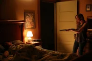 Cindy aiming a shotgun at sleeping Bob. Cindy aiming a shotgun at sleeping Bob.