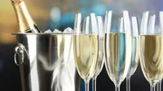 Champagne in glasses on restaurant background Champagne in glasses on restaurant background