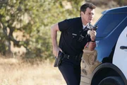 Nathan Fillion als John Nolan