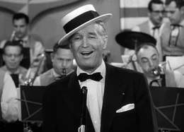 Der Strohhut wird zum Markenzeichen des charmanten Allroundkünstlers aus Paris, Maurice Chevalier.