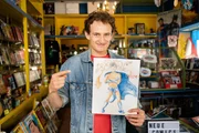 Checker Julian mit seinem Superhelden-Charakter "Checkman"