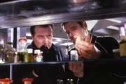 L-R: Tibbet (Patrick Macnee), James Bond (Roger Moore)