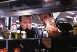 L-R: Tibbet (Patrick Macnee), James Bond (Roger Moore)
